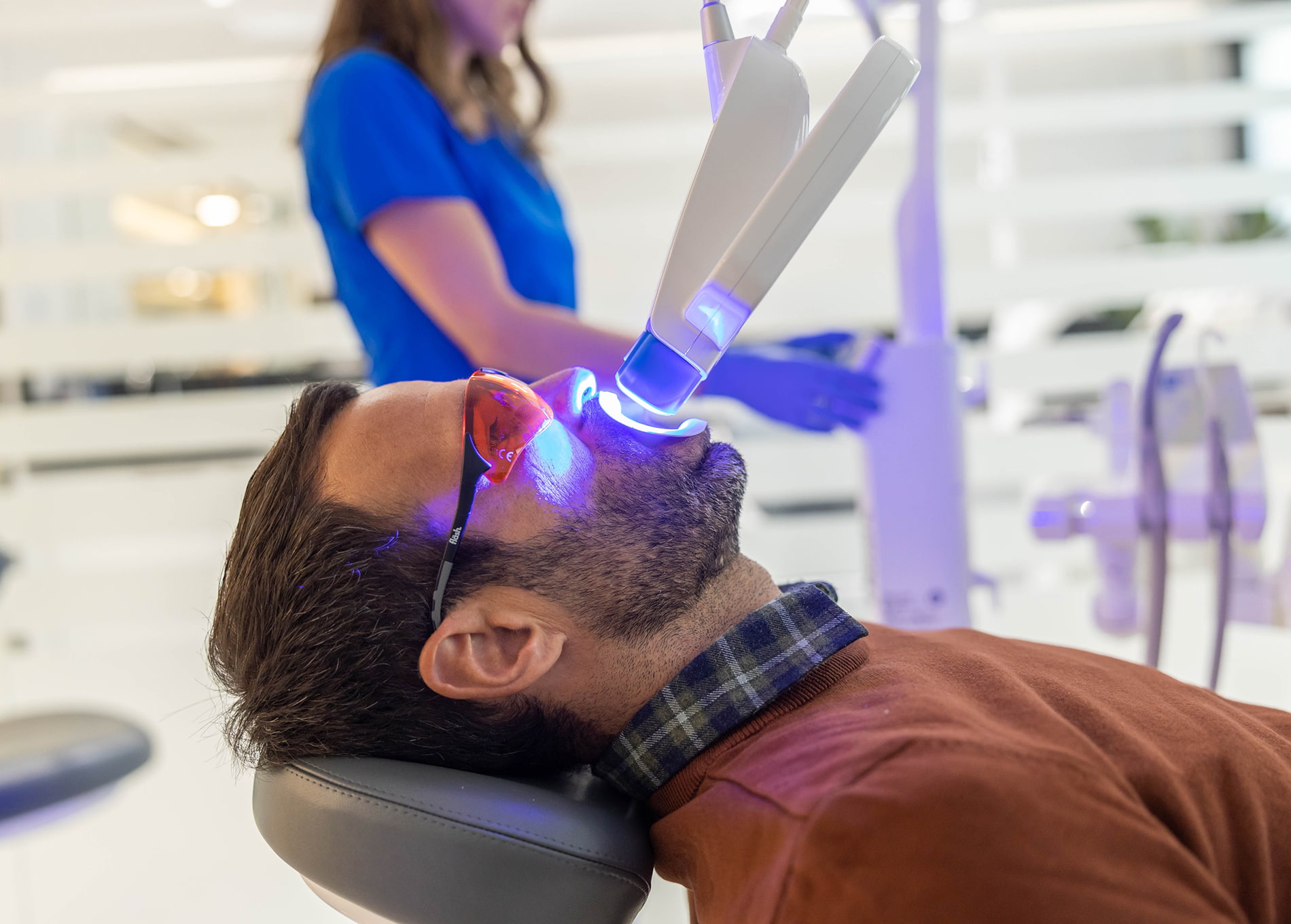 Professional teeth whitening brightens stained or discolored teeth for a radiant smile